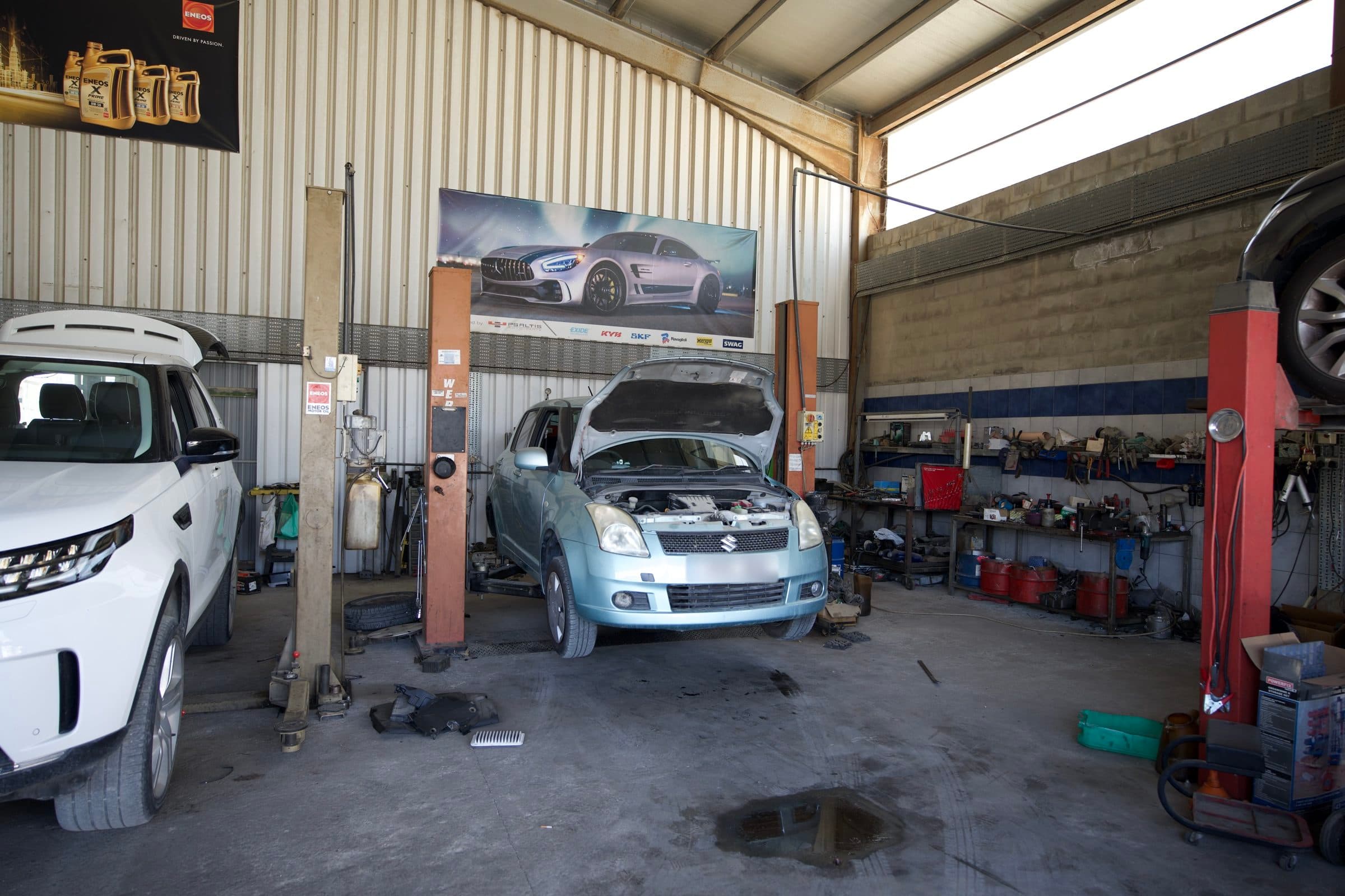 The service bays, with a car in for work under the bonnet